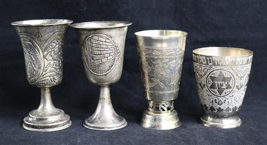 Four assorted Judaica silver goblets.